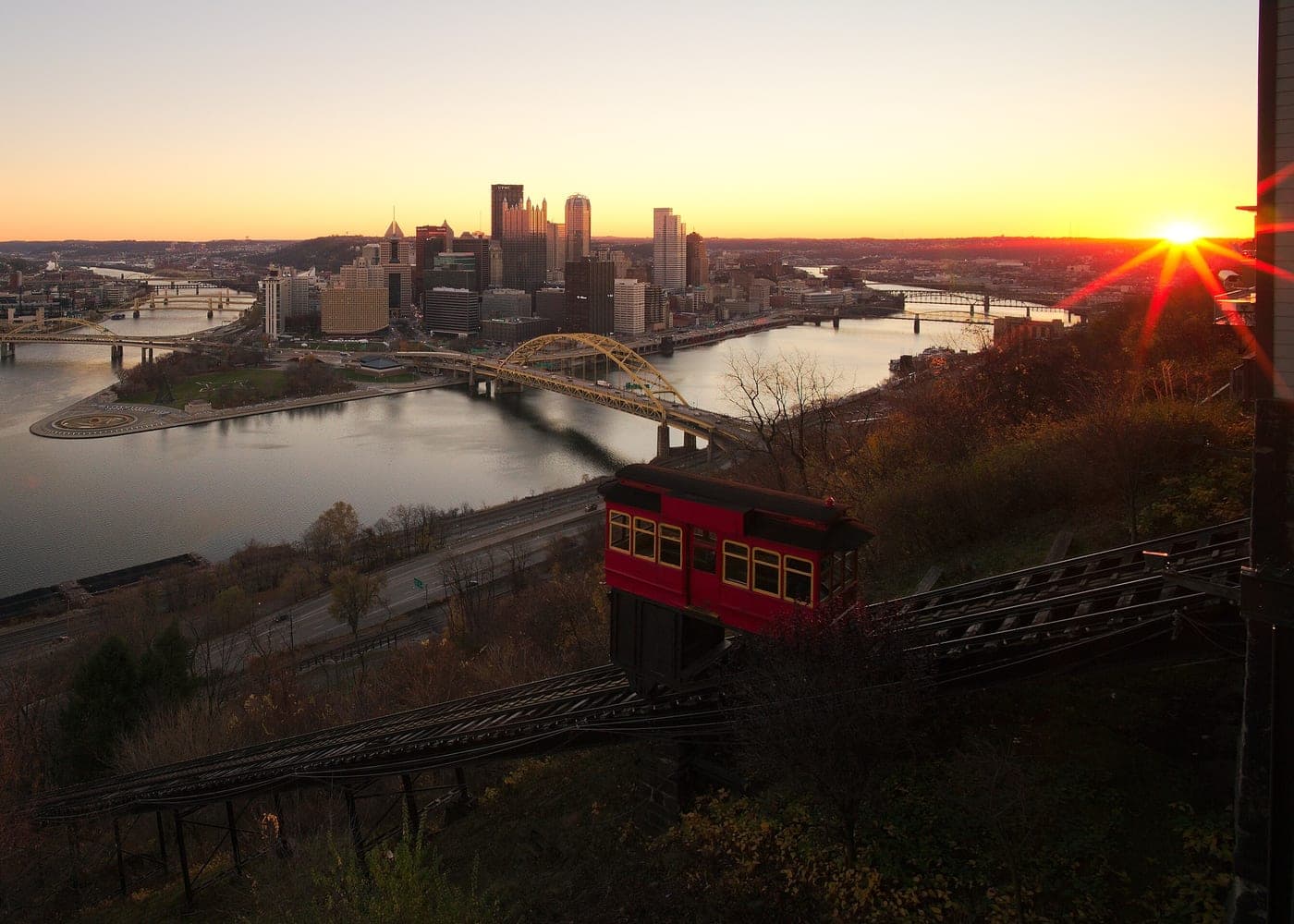 Downtown Pittsburgh in warm dawn light, seen from the historic incline hillside