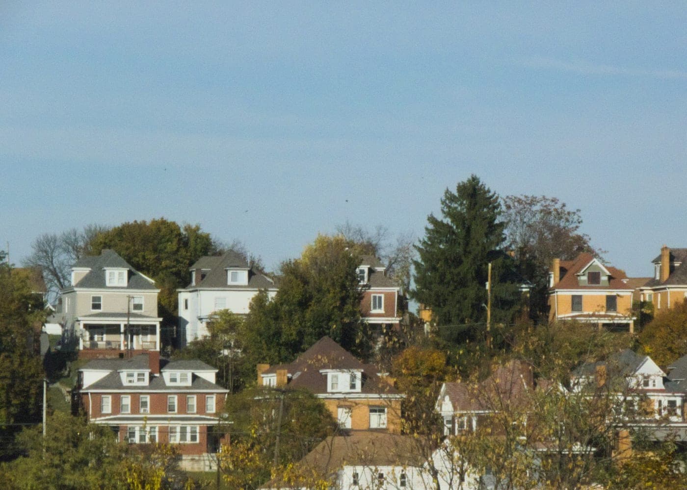 Pittsburgh hillside neighborhood with houses stepping down a green slope