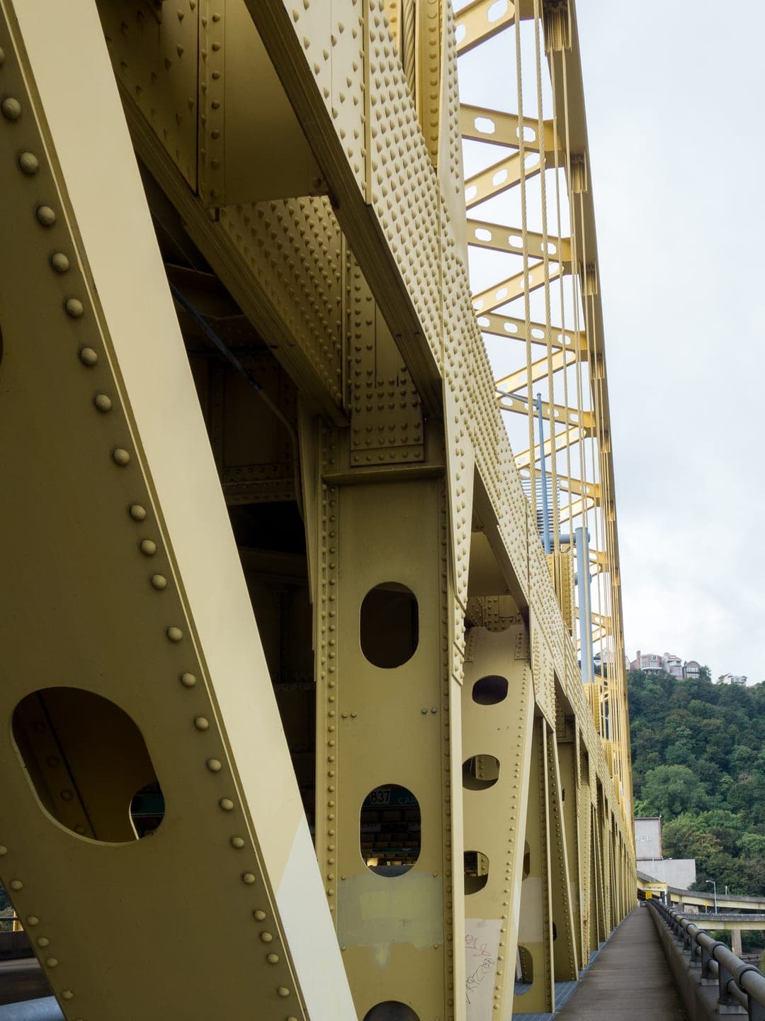 Illuminated Pittsburgh bridge walkway at dusk