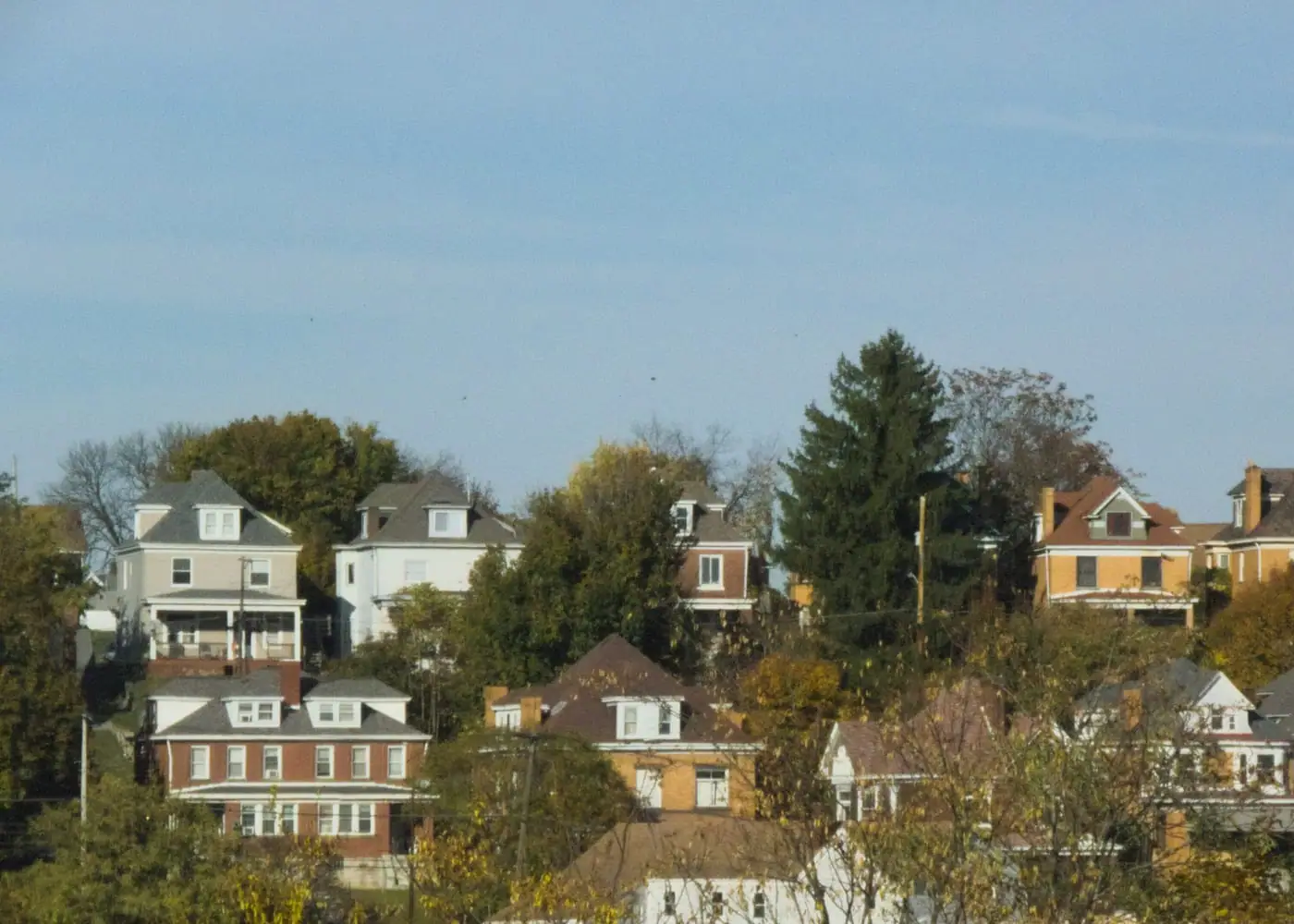 Pittsburgh hillside neighborhood with houses stepping down a green slope